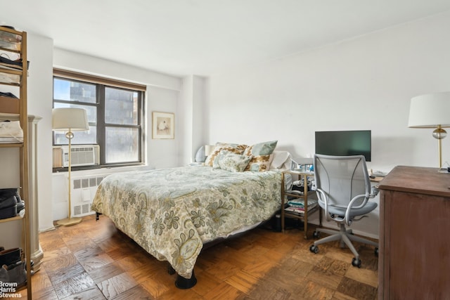 bedroom featuring cooling unit and radiator