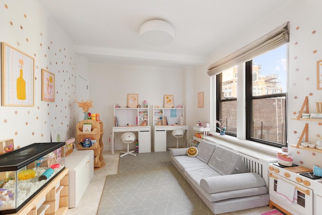 recreation room featuring wallpapered walls