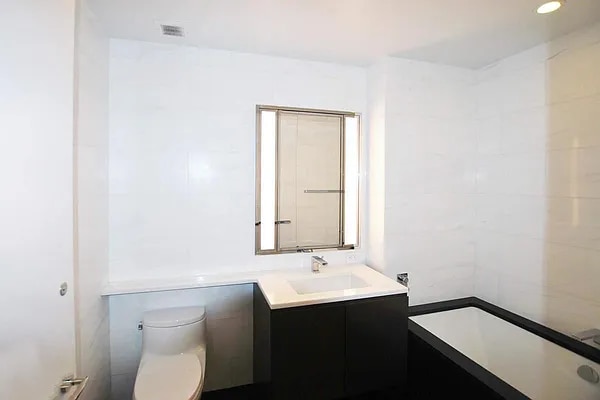 full bath with toilet and vanity