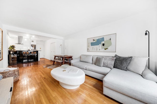 living area with hardwood / wood-style flooring