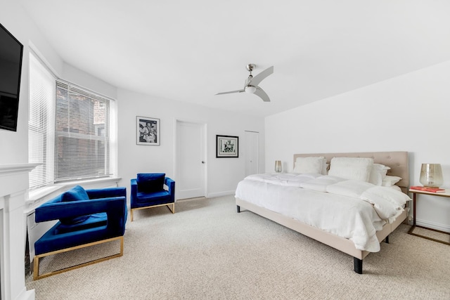 bedroom featuring carpet floors, baseboards, and a ceiling fan
