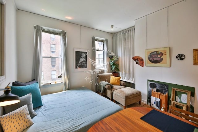 bedroom with multiple windows