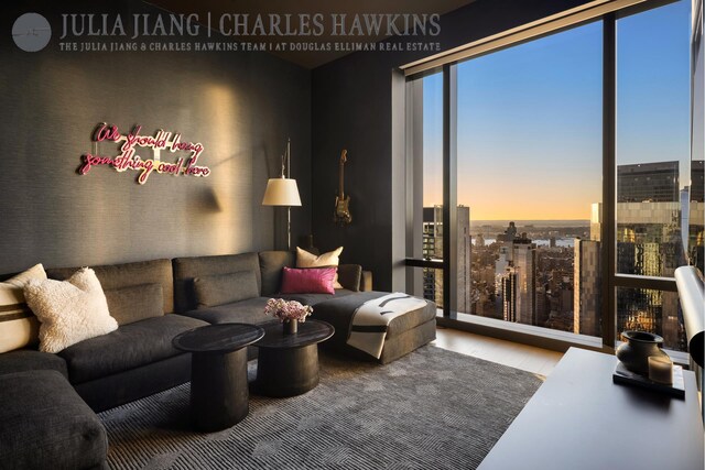 living room featuring a view of city and wood finished floors