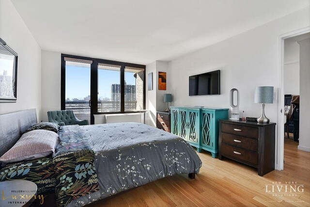 bedroom with light wood-type flooring