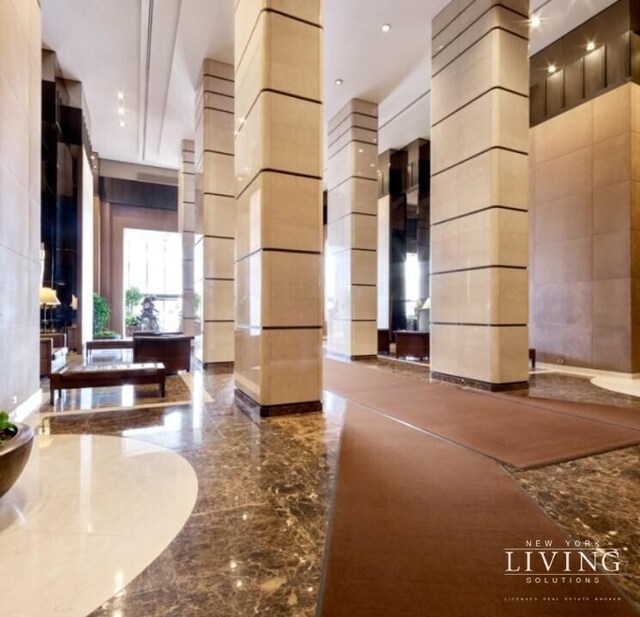 330 E 38th St Unit 24A, New York City, NY 10016 - common area featuring a towering ceiling