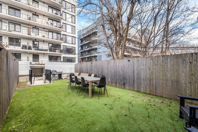 view of yard with a fenced backyard