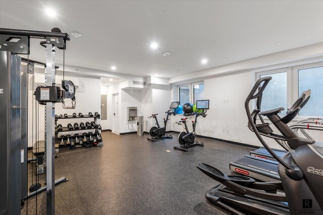 workout area with recessed lighting and baseboards