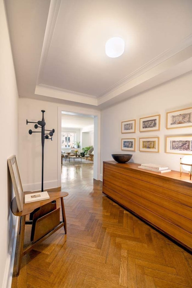 530 Park Ave Unit 5A, New York City, NY 10065 - corridor with crown molding, a raised ceiling, and baseboards