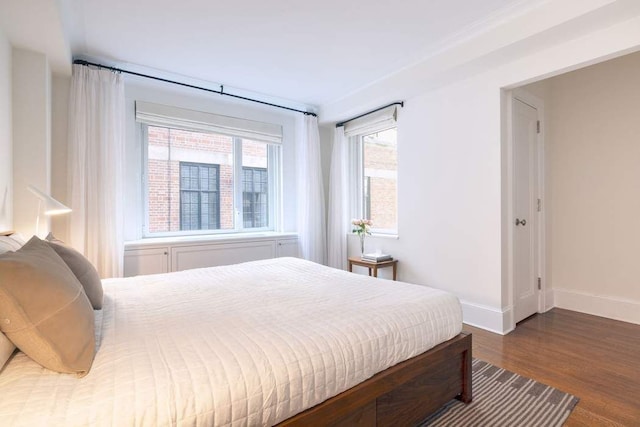 530 Park Ave Unit 5A, New York City, NY 10065 - bedroom featuring baseboards and wood finished floors