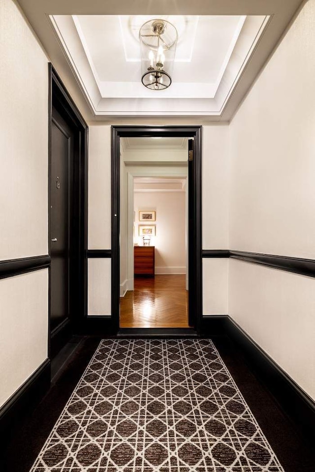 530 Park Ave Unit 5A, New York City, NY 10065 - corridor with baseboards, wood finished floors, and a raised ceiling