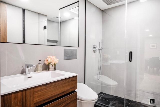 full bath with vanity, toilet, visible vents, and a stall shower