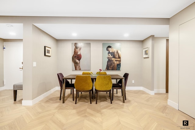 dining area featuring baseboards