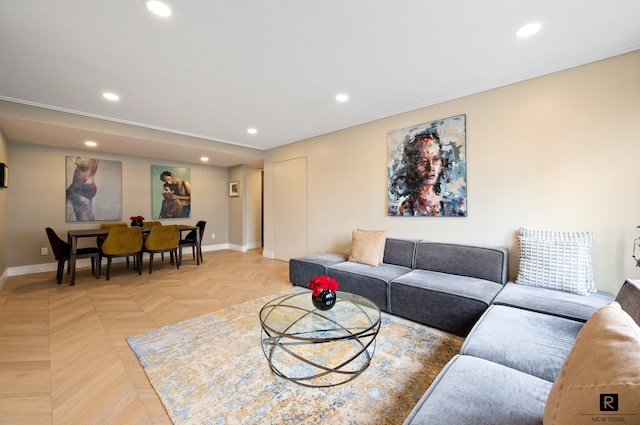 living area featuring recessed lighting and baseboards