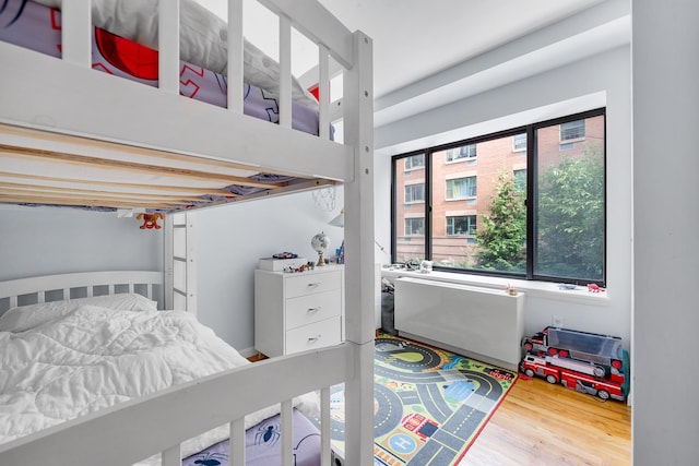 69 E 130th St Unit 2A, New York City, NY 10037 - bedroom featuring wood finished floors