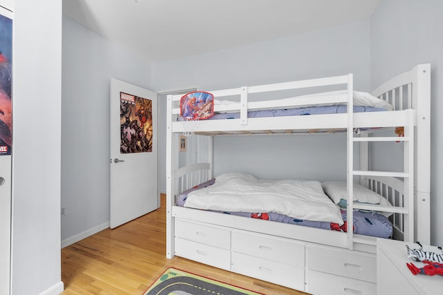69 E 130th St Unit 2A, New York City, NY 10037 - bedroom featuring baseboards and light wood-style flooring