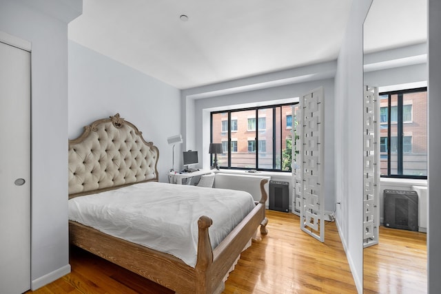 69 E 130th St Unit 2A, New York City, NY 10037 - bedroom with multiple windows and light wood finished floors