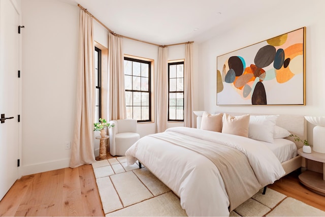 bedroom featuring wood finished floors