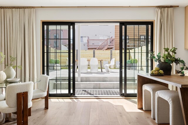 doorway to outside featuring hardwood / wood-style flooring