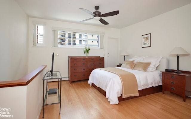 bedroom featuring ceiling fan and light wood finished floors