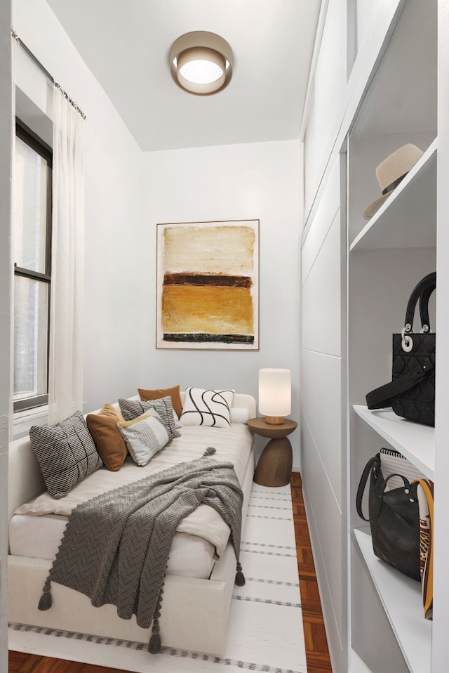 bedroom with wood finished floors