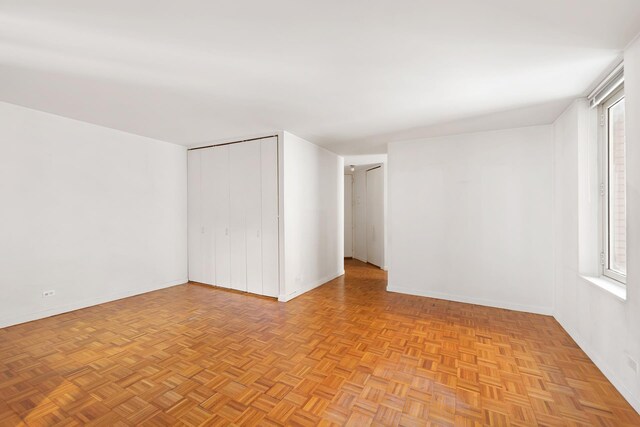 145 E 48th St Unit 8B, New York City, NY 10017 - spare room with baseboards