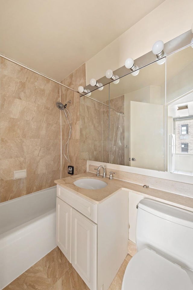 full bathroom featuring shower / bath combo, vanity, and toilet