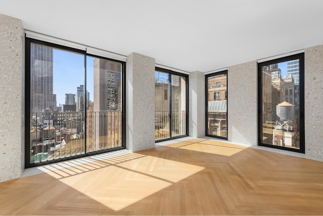 16 W 40th St Unit 21C, New York City, NY 10018 - unfurnished room with expansive windows and a view of skyline