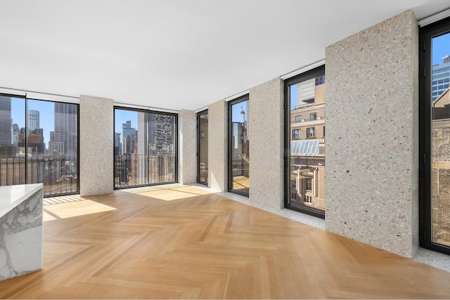 16 W 40th St Unit 21C, New York City, NY 10018 - empty room featuring a view of skyline and expansive windows