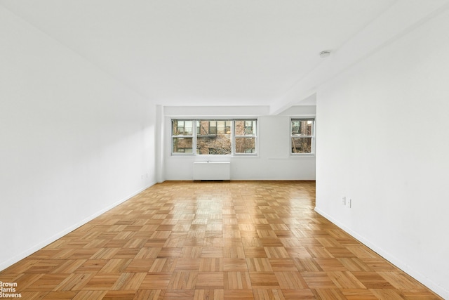 empty room with baseboards