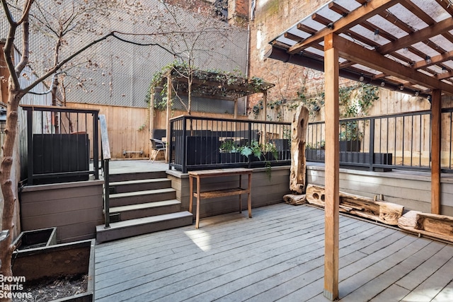 wooden deck with fence and a pergola