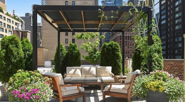 view of patio / terrace featuring an outdoor living space and a city view