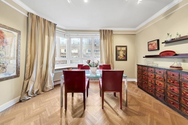 dining room featuring baseboards and crown molding