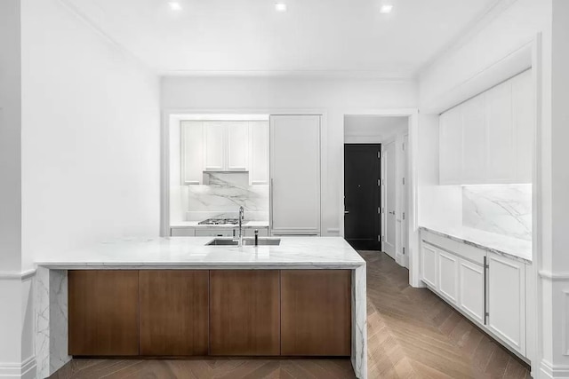 interior space featuring tasteful backsplash and a sink