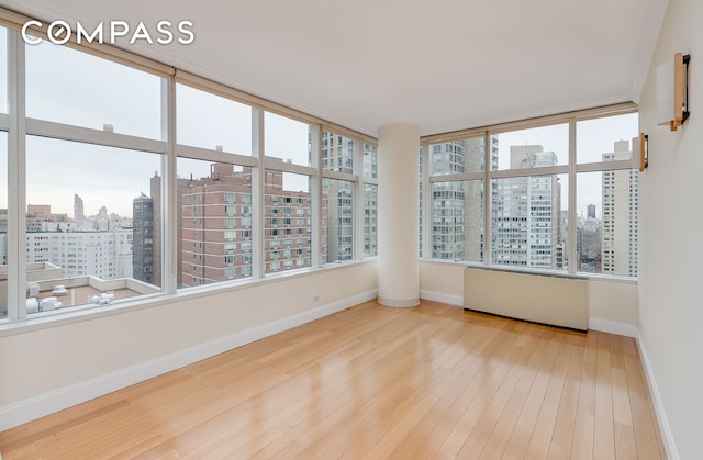 unfurnished sunroom with a view of city