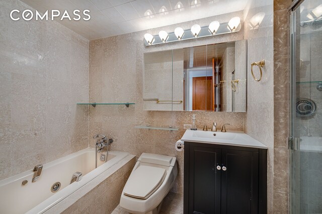 160 W 66th St Unit 23D, New York City, NY 10023 - full bath featuring tile walls, a shower stall, a garden tub, toilet, and vanity