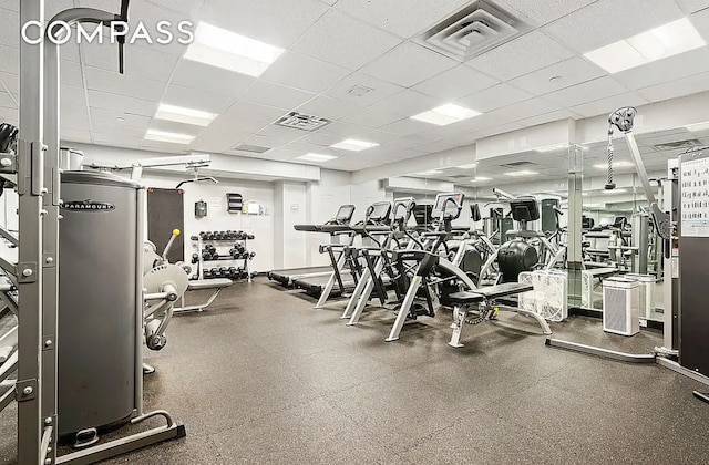 workout area featuring a drop ceiling and visible vents