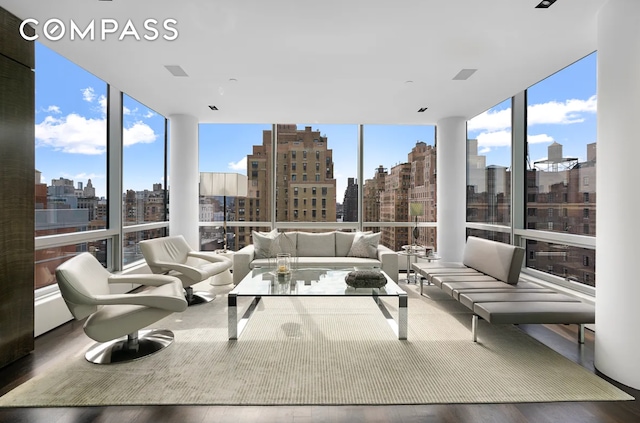 sunroom / solarium featuring a healthy amount of sunlight and a view of city