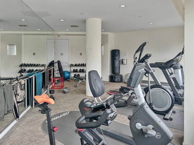 exercise room with carpet, visible vents, and recessed lighting