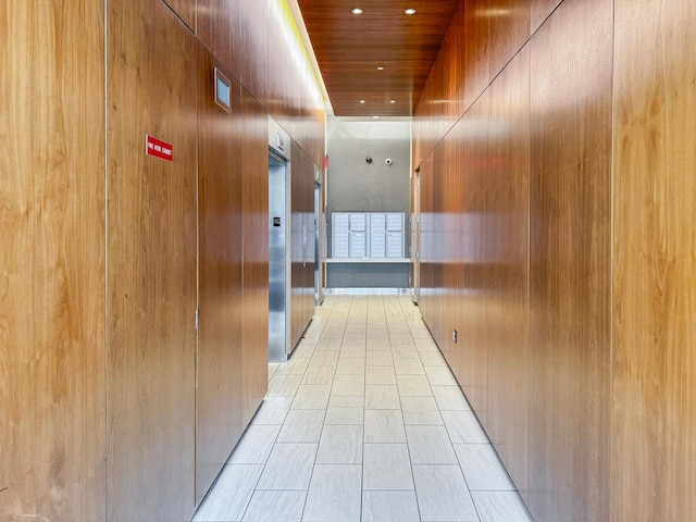 hallway featuring light tile patterned floors, wooden ceiling, and recessed lighting