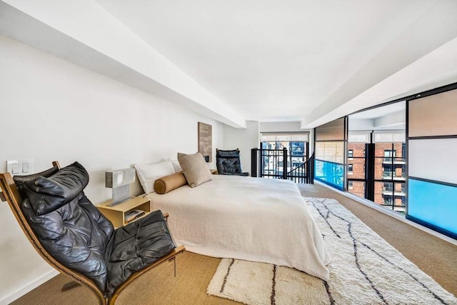 bedroom with baseboards and carpet flooring