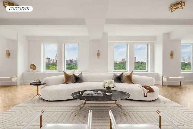 living area featuring baseboards, a view of city, and visible vents