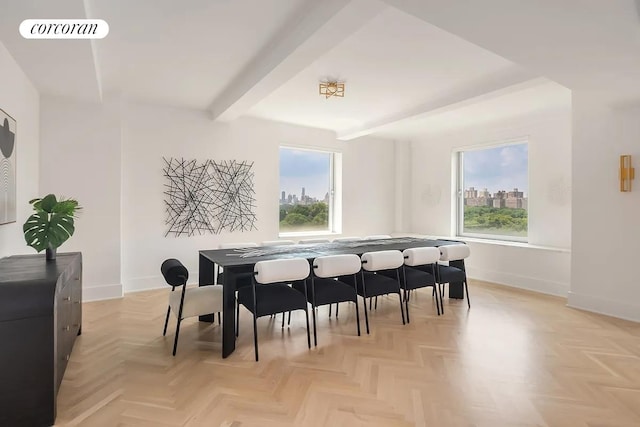 interior space featuring a view of city, beamed ceiling, visible vents, and a healthy amount of sunlight