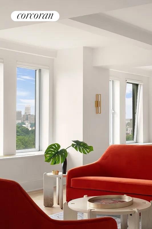 sitting room with a wealth of natural light and a city view