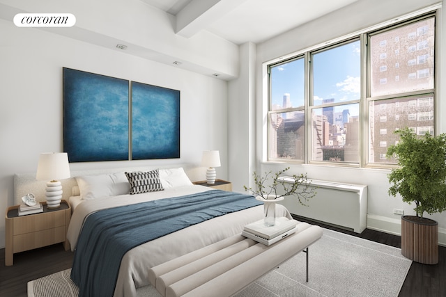 bedroom featuring beamed ceiling, wood finished floors, visible vents, and baseboards