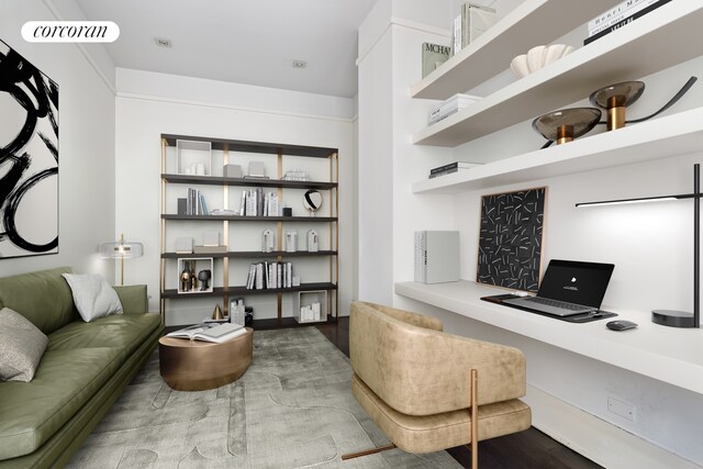 office space featuring built in desk and visible vents