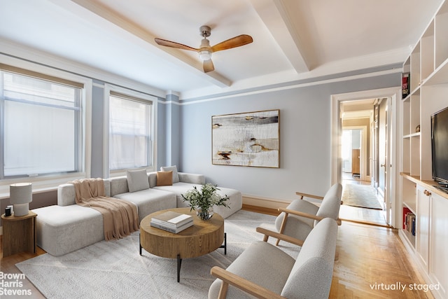 living room featuring beamed ceiling, ceiling fan, and wood finished floors