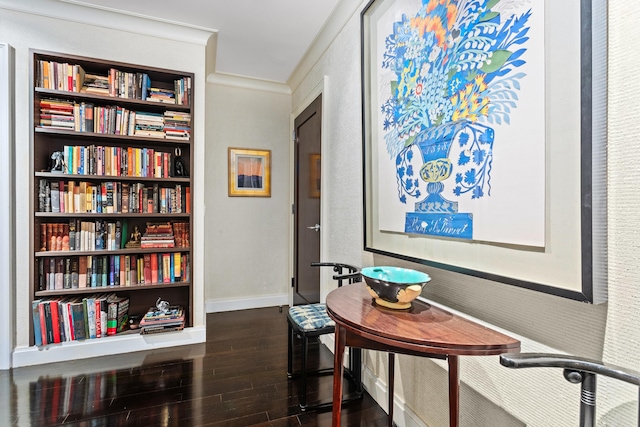 office space with ornamental molding, dark wood-type flooring, and baseboards