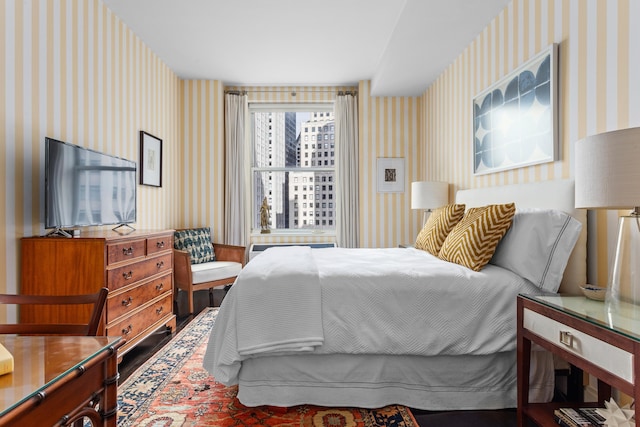 bedroom featuring wallpapered walls