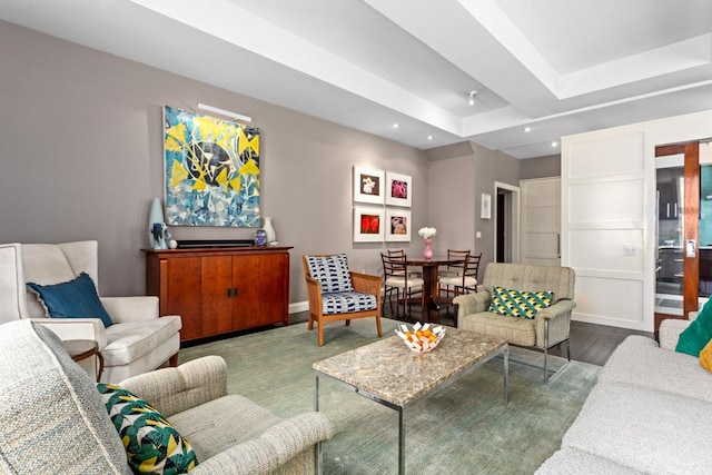 living area with recessed lighting, baseboards, and wood finished floors