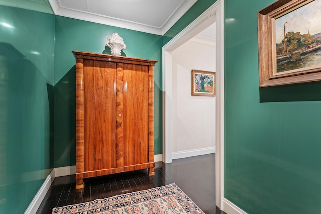 interior space featuring wood finished floors and baseboards